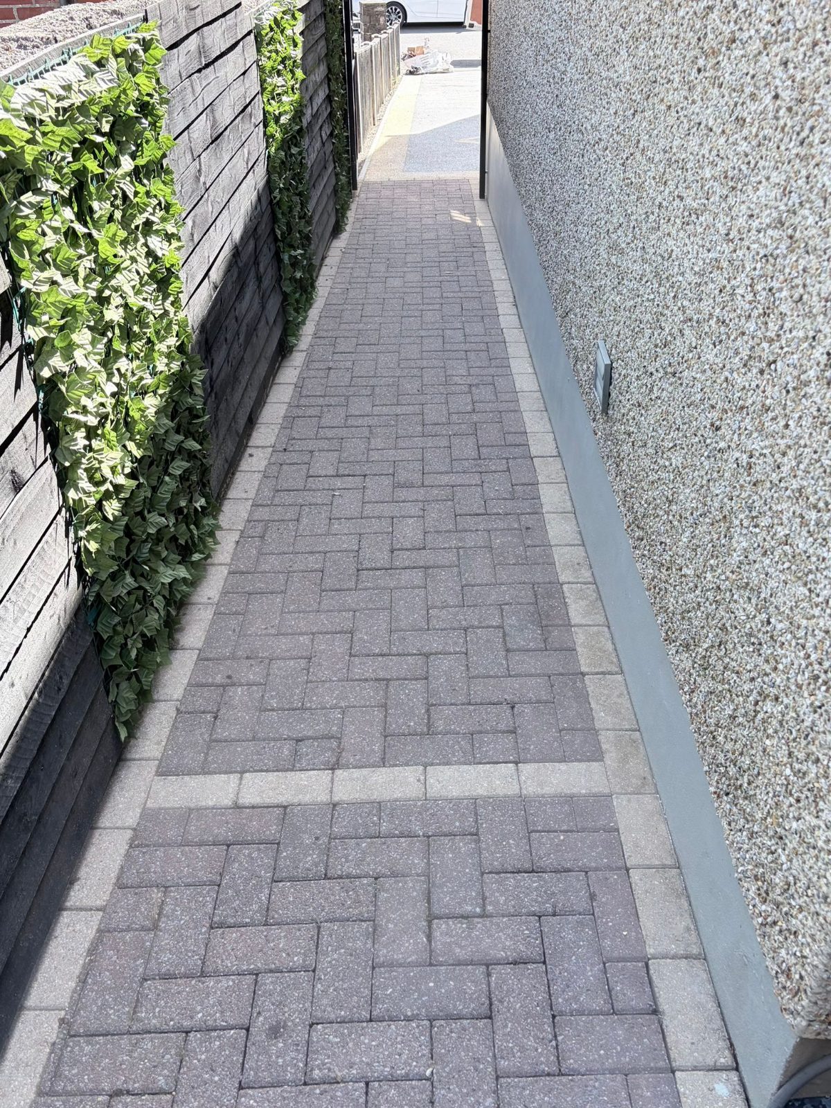 Block paving pathway restored like new after pressure washing