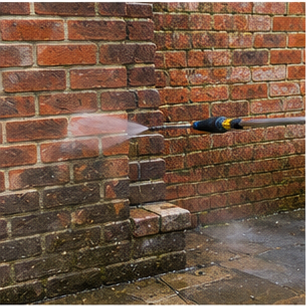 Pressure washing a brick wall clean
