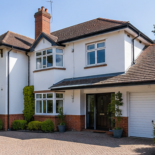 Soft washing a rendered house exterior